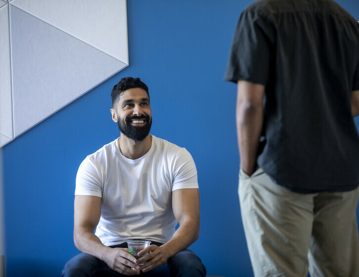 two team members chatting in the lobby